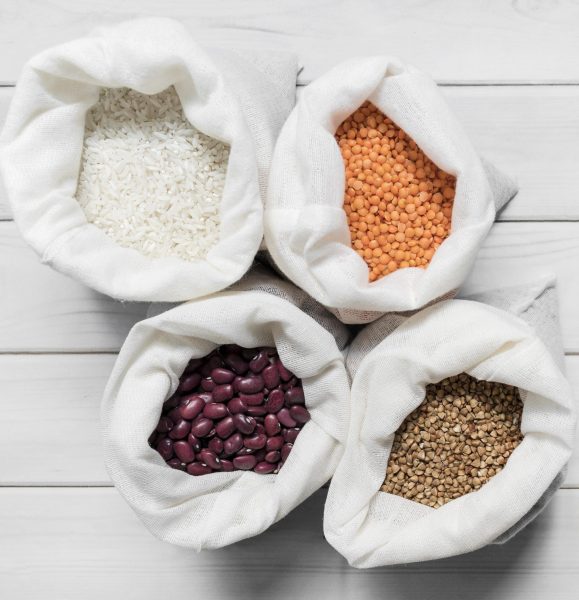 bags-with-different-beans-wooden-background